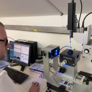 A rheology lab analyst working on the drop shape analyser